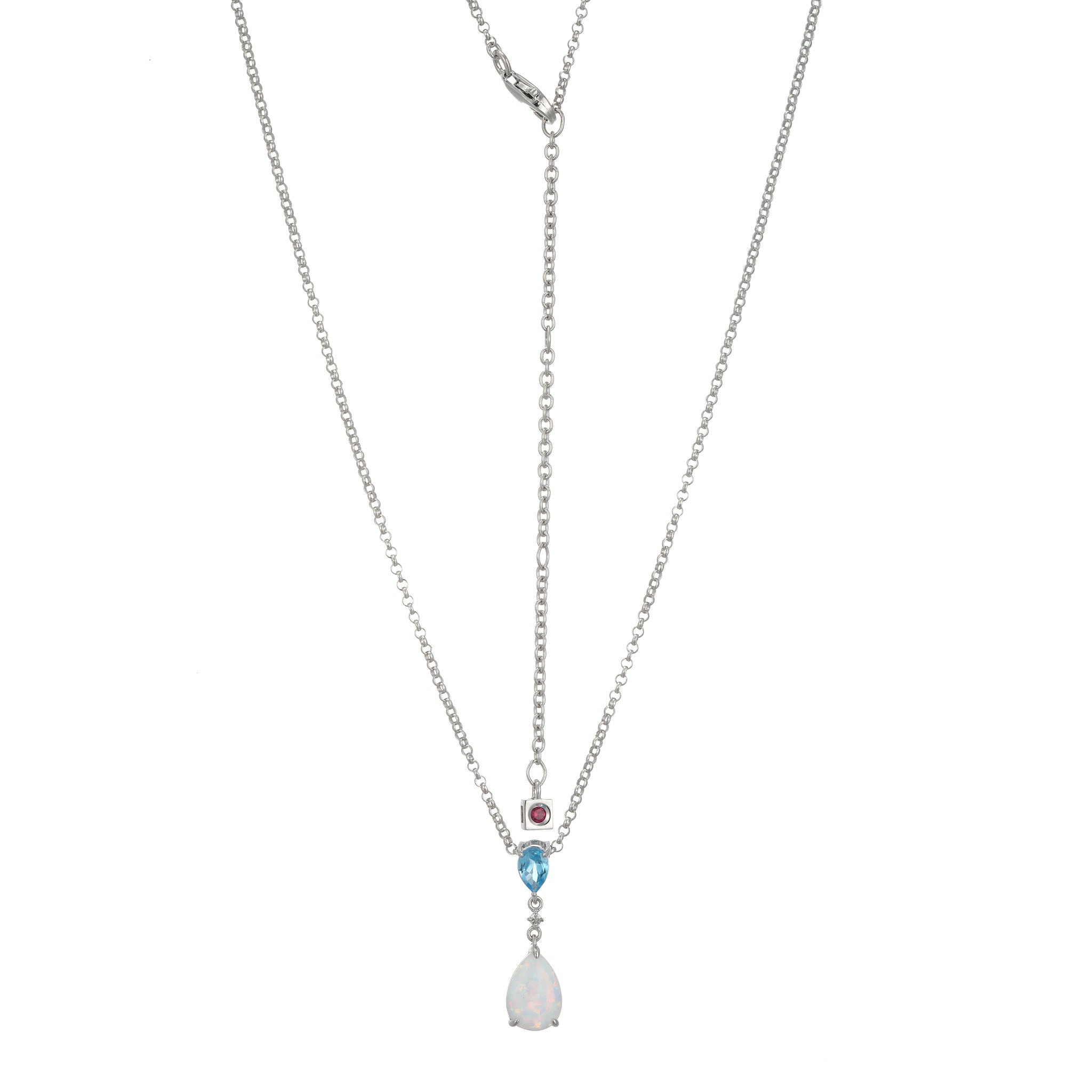 This Delicate Lariat Necklace Showcases A Unique Pairing Of Pearlescent Created Opal And Swiss Blue Topaz On A Rhodium-Plated Sterling Silver Chain. This Enchanting Combination Accentuates Beauty From Every Angle And Adds A Touch Of Modern Flair.